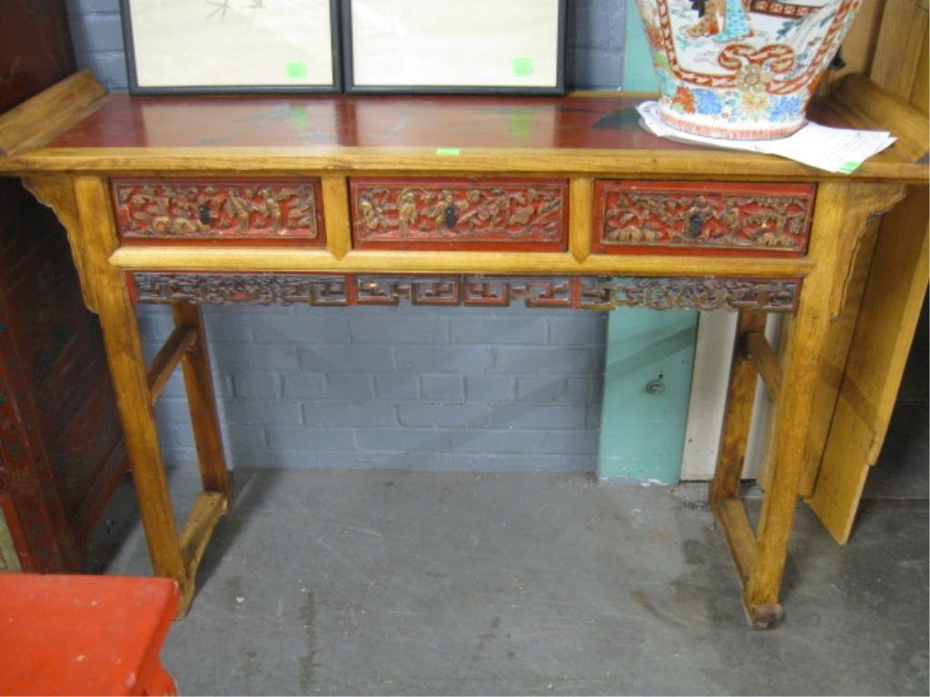 Chinese Altar Table: Chinese altar table, red lacquered with landscape paintings & hardwood frame, three figural relief carved drawers & reticulated apron, early 20th C., 56 1/2 " x 1 53/4" x 37 1/2" CONDITION: Normal wea