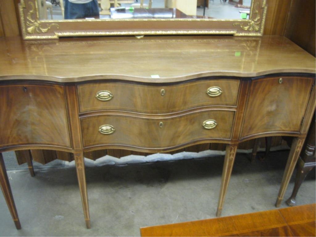 Hepplewhite Style Sideboard: Hepplewhite-style sideboard, mahogany with line & bell flower inlay, by "Hickory Masterpiece Collection", serpentine front, brass gallery, mid to late 20th C. 66" x 21 1/2" x 38 1/2" CONDITION: Sun bl