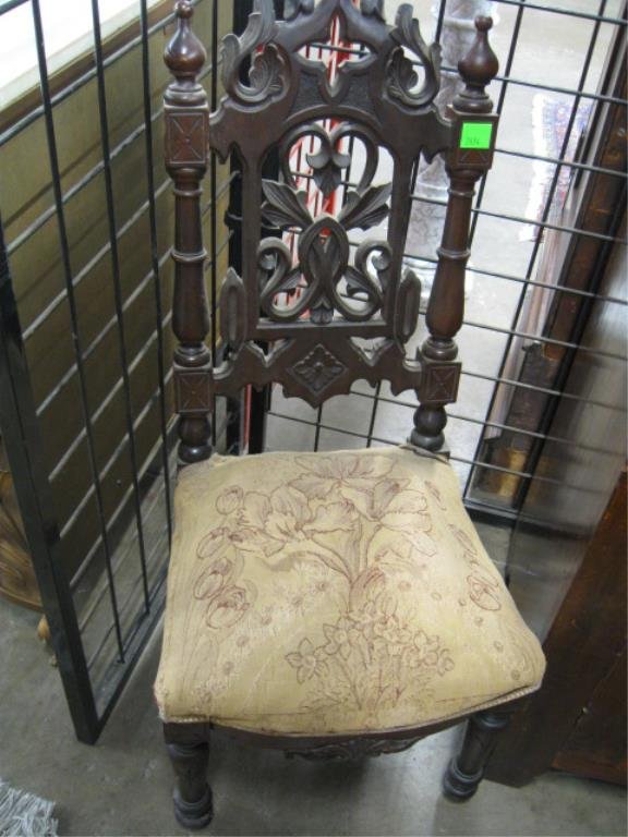 Gothic Revival Slipper Chair: Gothic Revival slipper chair, walnut, overall pierced scroll carved back, upholstered seat, c 1860, 37 1/2" h. CONDITION: Normal wear, expansion crack on crest.