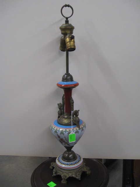 Renaissance Revival Urn Lamp: Renaissance Revival urn lamp, opaque glass font & base with Japonism stenciled designs, brass caryatid handles, with rosette & dolphin cast base, electrified & fitted as a lamp, late 19th C. height to