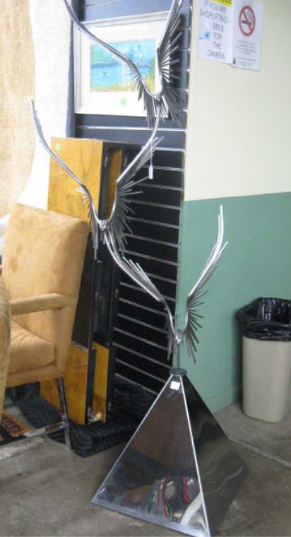 Curtis Jere"Monumental Eagles in Flight" Sculpture: Curtis Jere 1976, "Monumental Eagles in Flight", chromed metal sculpture on pyramid form base, [14b] 74 3/4" h CONDITION: No issues identified.