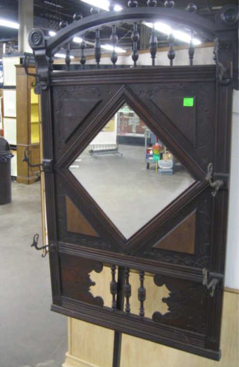 Eastlake Wall Mount Mirrored Rack: Eastlake wall mount mirrored coat rack, walnut, stick & ball & incised embellishments, ram's head metal hooks, late 19th C. 49" h, 32" l CONDITION: No issues identified.