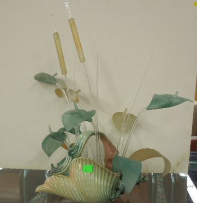 Hull Ceramic Center Piece: Hull ceramic center piece, in form of a conch shell with handle, filled with glass beads holding lucite flowers, 20" x 28" x 16" overall. CONDITION: No issues identified.