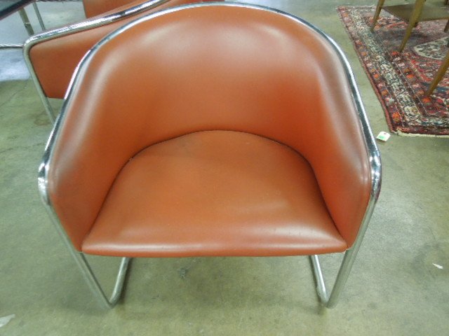 Set of 7 Marcel Bruer-Style Arm Chairs: Set of seven Marcel Bruer style arm charis, by Thonet Industries, chrome tubular frames with burnt umber faux leather upholstery, late 20th C. 28 1/4" h CONDITION: Mild pitting on chrome, very few sur