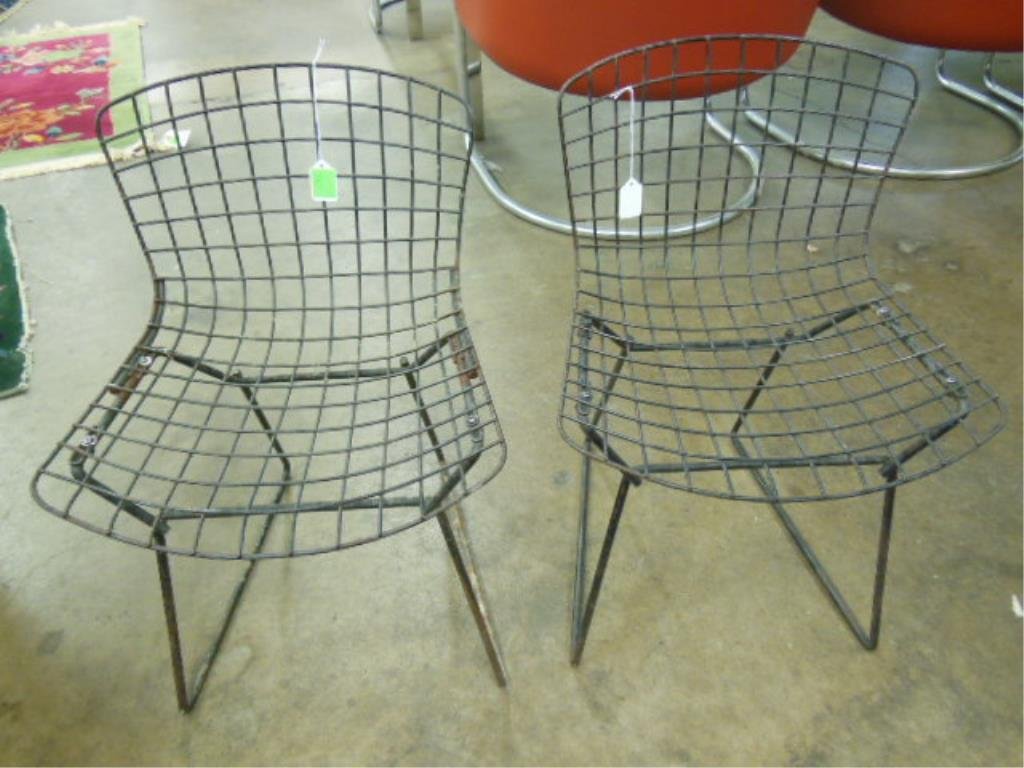 Pr Harry Bertoia Children's Chairs: Pair of Harry Bertoia for Knoll children's chairs, black metal, mid 20th C. 23 1/2" h CONDITION: loss of black finish, rusted areas throughout.
