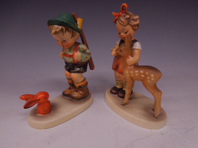 2 Hummel Figurines: Two Hummel figurines, Friends, #136/1, Mark 4, 5 1/4' h & Sensitive Hunter, #6/0, Mark 3, 5" . CONDITION: No chips, cracks, minor crazing on dress & deer & base of boy.