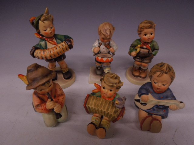 6 Hummel Figurines (Music): Six Hummel figurines (music), three mark 3, Accordion Boy, #185, 5 1/2" h, Trumpet Boy, #97, 4 1/2" & Joyful, #53, 3 1/2" h, plus three Mark 4, Little Drummer, #240, 4 1/2"h, Little Tooter, #214 H, 3