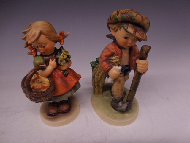 2 Hummel Figurines: Two Hummel figurines, On Secret Path, #386, 5 1/2" h & Autumn Harvest, #355, both Mark 5. CONDITION: No chips, cracks, very minor crazing under base 386, minor crazing on bottom & base & side of face 