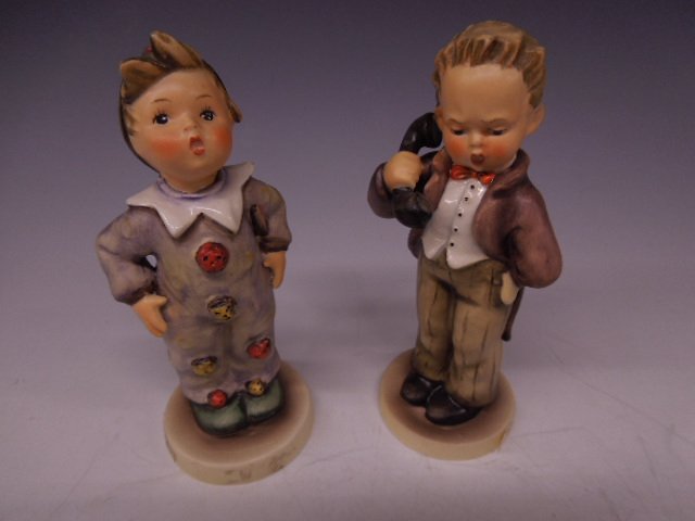 2 Hummel Figurines: Two Hummel figurines, Hello, #124/0, Mark 3, 6"; & Carnival, #328, Mark 4, 6"h. CONDITION: No chips, cracks, some crazing throughout #328, at base #124.