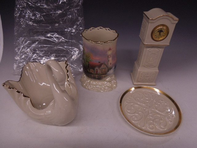 4 Assorted Lenox Pieces: Four assorted Lenox pieces, including; quartz grandfathers clock, moon & sun diam, 8 1/2' h swan planter, 9"l x 6"h, small plate Maltese cross center, 6 1/4" d & "Beacon of Hope Votive" light house sc