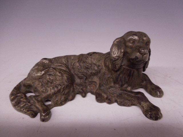 Cast Iron Spaniel Doorstop: Cast Iron Spaniel dog doorstop, laying down, hand painted, silver, hollow, unmarked, 5 3/8: x 2 1/2"l Condition; some paint loss throughout
