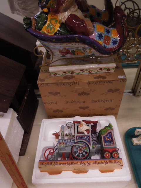 2 Christmas Santa Figures: One Jim Shore, "North Star" Santa train, with original box & Christmas Traditions porcelain Santa in sleigh. CONDITION: North Star new in box, Traditions-very good.
