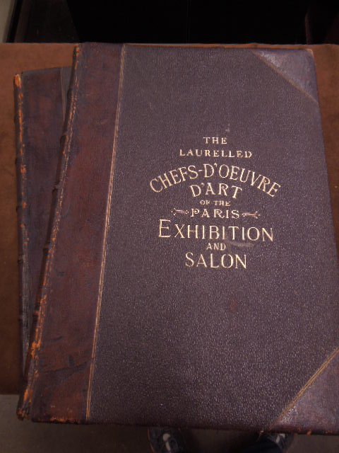 2 Vols Laurelled Chef's D'Oeuvre D'Art Books: Two volumes of The Laurelled chef's - D'Oeuvre D'Art books. From The Paris Exhibition & Salon 1889, with descriptions by George A. Smith, Philadelphia, Gebbie & Co. CONDITION: Good, showing normal wea