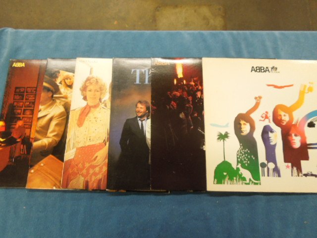 6 Vintage LPs Abba-The Album", "The Visitors", etc: Lot of six vintage Abba Lps including: "Abba-The Album", "Super Trouper", "the Singles", "Waterloo", "the visitors", "Abba". CONDITION: Good, minor wear.