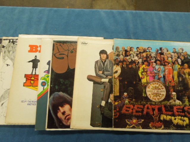 8 Beatles LPs: Lot of eight vintage Beatles LPs including: "Sgt. Peppers" - Capital - MAS-2653 with cut-outs, "Help" - Capitol - MAS-2386, "Yellow Submarine" - Capitol - SW153, "Rubber Soul" - Capitol -T2442, "Yeste