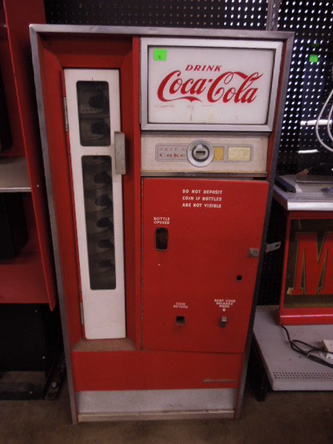 Vintage Coca-Cola Machine: Vintage Coca-Cola machine. Measures: 26" wide x 4 1/2" tall x 21" deep. CONDITION: Fair, shows wear from age & use, not tested.