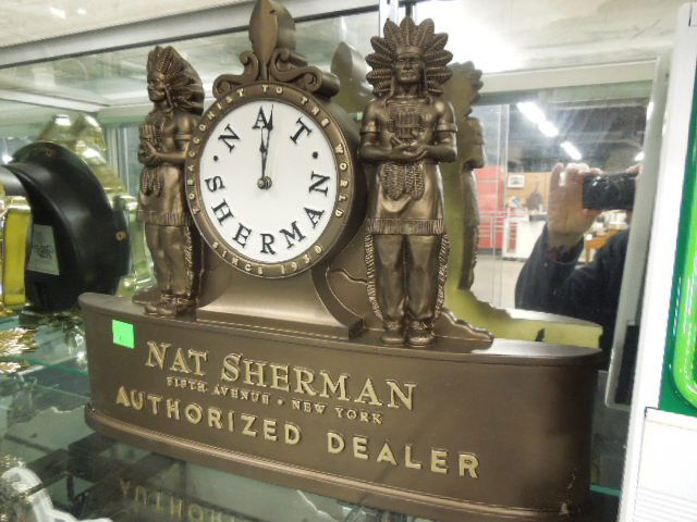 Nat Sherman Authorized Dealer Wall Clock: Nat Sherman Authorized Dealer wall clock, battery powered, plastic. Measures: 23" wide x 17 1/2' tall x 1 1/2" deep. CONDITION: New old stock.