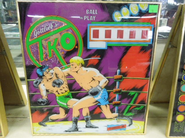Framed Vintage Pinball Machine Back: Framed vintage pinball machine back. Gottlieb's "TKO" circa 1979. Measures: 20 1/4" wide x 22" tall x 3/4" deep. CONDITION: Fair, reverse decal cracked & chipped away.