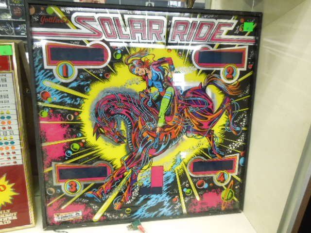 Framed Gottlieb's Pinball Back: Framed Gottlieb's pinball back "Solar Ride" circa 1978. Measures: 26 1/2" square x 2 1/2" deep. Back lit. CONDITION: Good, lights not working.