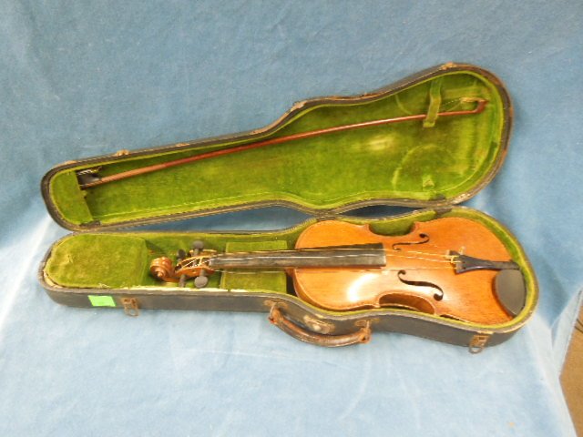Vintage 1/2 Size German Strad Copy Violin: Vintage 1/2 size German Strad Copy Violin Tiger Back, comes with case and unmarked bow. CONDITION: Fair, shows wear and finish loss.