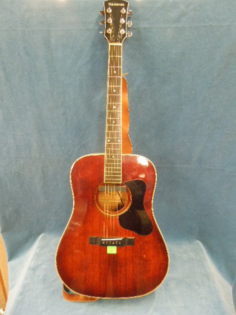 Madeira Acoustic Guitar by Guild: Madeira Acoustic Guitar by Guild Model: A-32SB with accessory external pick up and case. CONDITION: Fair used, shows wear.