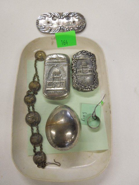 1893 Columbian Exposition Souvenirs: 1893 Columbian Exposition souvenirs, including: Columbus egg puzzle, two silver plate match holders, silver plate double number counter, Columbus coin bracelet & El Anillo Ysabel sterling ring. CONDIT
