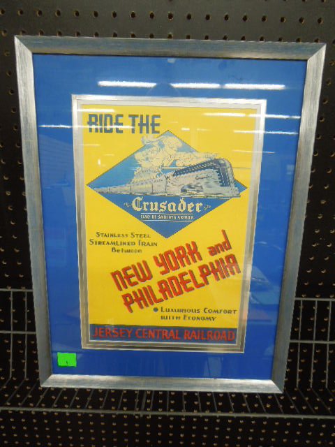 Framed "Ride the Crusader" poster: Framed "Ride the Crusader" poster, clad in shining armor, stainless steel streamlined train between New York and Philadelphia, Jersey Central Railroad, triple matted and framed, 16" x 21" Condition; n