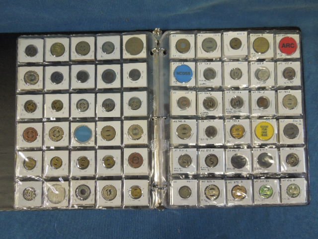 150 Transportation Tokens in Binder: 150 transportation tokens in binder, including: bus, trolley, bridge, many obsolete, all in cardboard sleeves behind plastic. CONDITION: No issues identified.