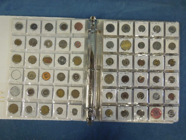 160 Transportation tokens in binder: 160 Transportation tokens in binder, including: bus, trolley and other, many rare and obsolete, all in cardboard sleeves behind plastic. CONDITION: No issues identified.