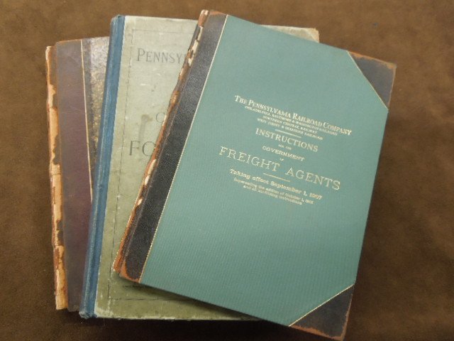 PRR: Freight/ Passenger Tariff Publications: [3 pieces] Pennsylvania Railroad publications: (1) "Instructions for the Government of Freight Agents" (1907); (2) "Chart of Forms - Foreign Tickets" (1917); (3) (Ledger with no entries) "Record of Da