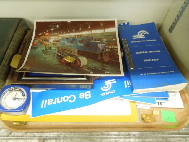 Vintage Conrail Ephemera: Tray lot, vintage Conrail ephemera: employee time table; safety rules; calendars; ruler; framed plaque, signage, etc., 1970's - 80's. CONDITION: Good.