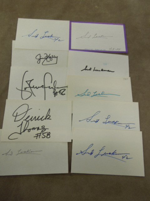 10 Signed Index Cards Football: Ten signed index cards football, including: seven Sid Luckman, Derrick Thomas, Jim Kelly & Lawrence Taylor, Note: We do not guarantee authenticity of any signature CONDITION: Some wear to card edge..