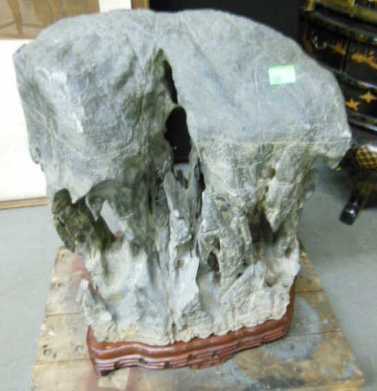 Ancient Chinese Wishing Stone: Ancient Chinese Wishing Stone, unique natural dark grey stone formation resting upon a vintage carved and fitted rosewood base, approx 17" x 13 1/2" x 18 1/2", weight exceedingly heavy. NOTE: Local pi
