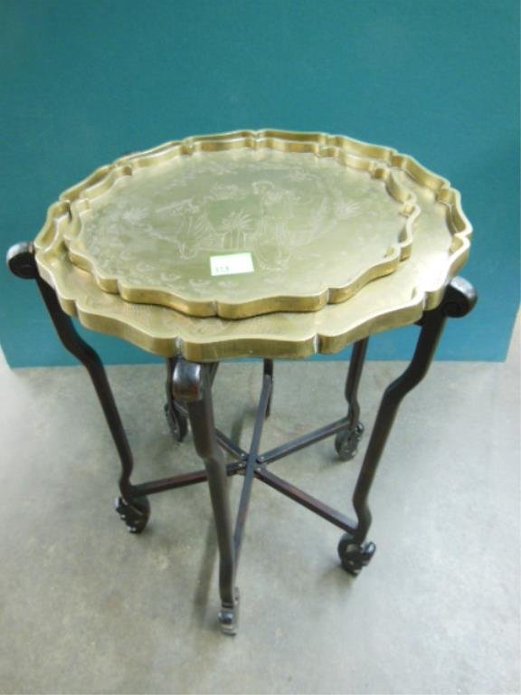 Chinese brass and wood stand: Chinese brass and wood tray stand with twin graduated scalloped - edge trays, five shaped and carved adjustable legs. Late 19th / early 20th c. 20 3/4"=H. CONDITION: Minor rubbing to finish of legs.