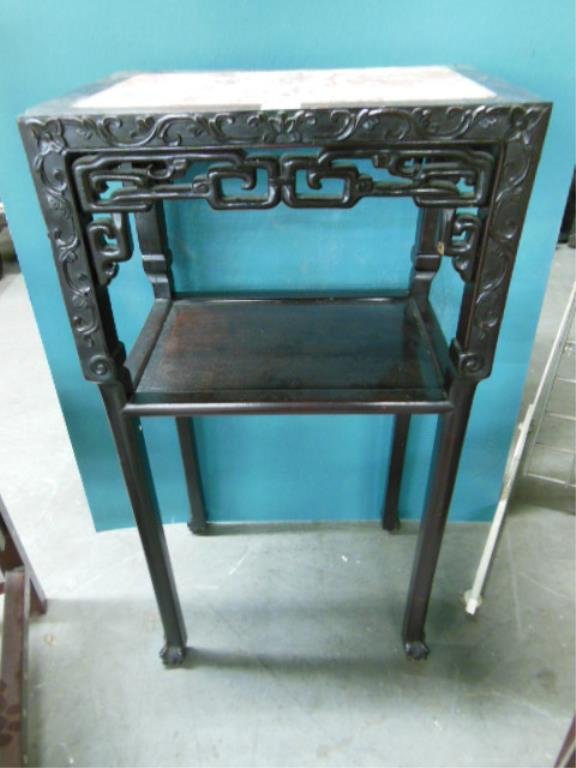 Chinese 2 Tier Plant Stand: Chinese two tier plant stand, relief & open work scroll carved rosewood, inset rouge marble top, early 20th C., 31 3/4" x 17" x 11 3/4". CONDITION: 1" wood chip on one top corner.