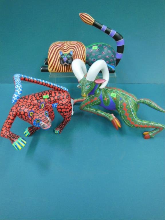 3 Mexican Oaxacan Wood Figures: 3 Mexican Oaxacan wood figures, tiger 13", Ram 18" and a Lion 14", all hand painted and artist signed Jose Hernandez M e hijos Evaristo Hernandez J, y Eraclio Hnz J (Tiger and Ram) and Maximiliano Mor