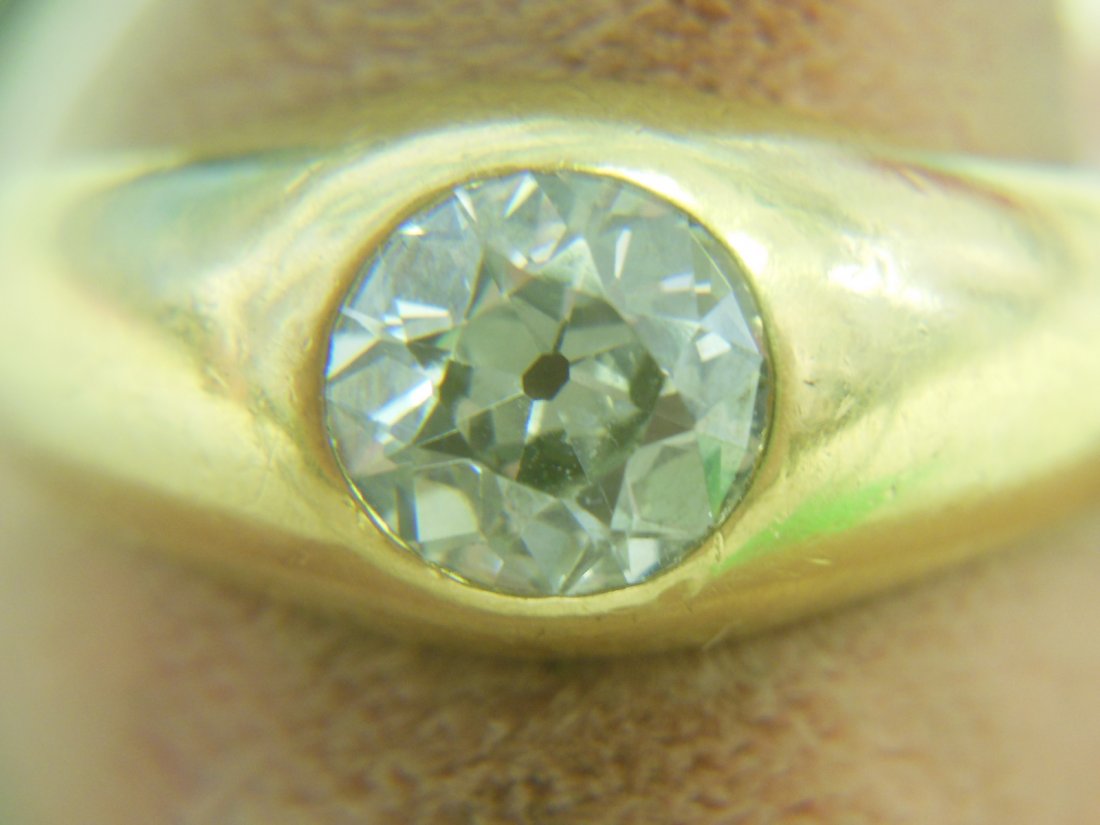 18k YG Gent's Diamond Ring: 18k YG Gent's Diamond Ring. Approx 1.5 ct round mine cut solitaire diamond set in 18k YG. Diamond appears to be very clear under microscope. No appraisal available. Size 7 1/4. 6 DWT. Circa 1950's - 6