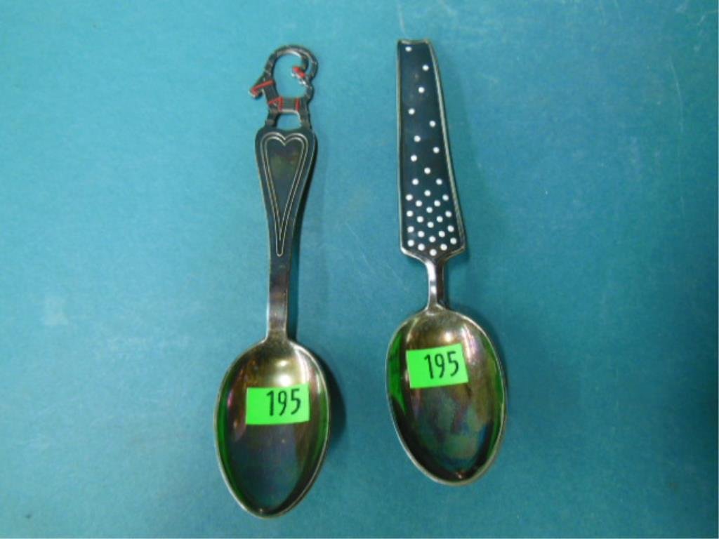 2 Danish Sterling Figural Spoons: Two Danish sterling figural spoons, Michelsen, Copenhagen one with an animal with some enamel, the other with a black enilel handle. 2.7 ozt