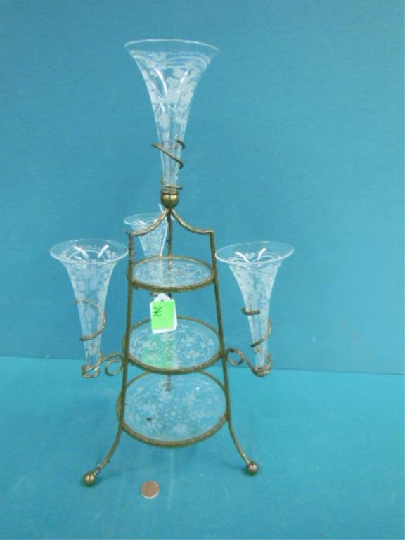 Victorian Trumpet Epergne: Victorian small-scale etched clear glass trumpet epergne, three-tiered with four vases, stamped wire - twisted metal frame. American, late 19th/ early 20th c. 16"=h. CONDITION: No issues identified.