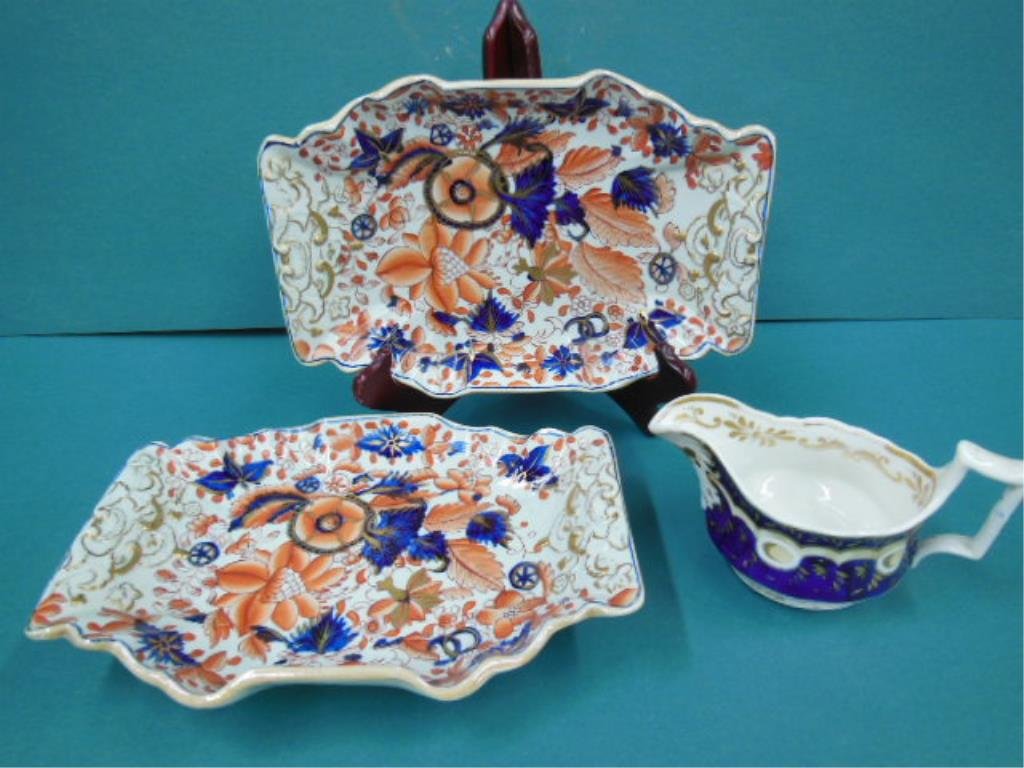 3 Pcs Mason's Ironstone: Pair of Mason's ironstone platters, in Gaudy Welsh patterns, with porcelain cobalt decorated gravy boat. Platters 10 1/2" x 7". Gravy 7" x 3". 29 CONDITION: Very food, gilt loss on gravy.