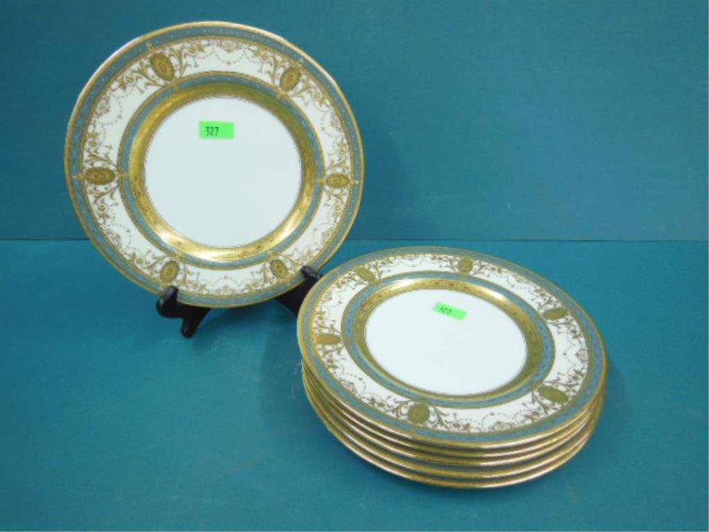 6 Minton Service Plates: Six Minton service plates, for Bailey Banks & Biddle Phila, with cream blue & elaborate gold scroll & medallion borders, 10 1/2" d, early 20th C. CONDITION: Very good.