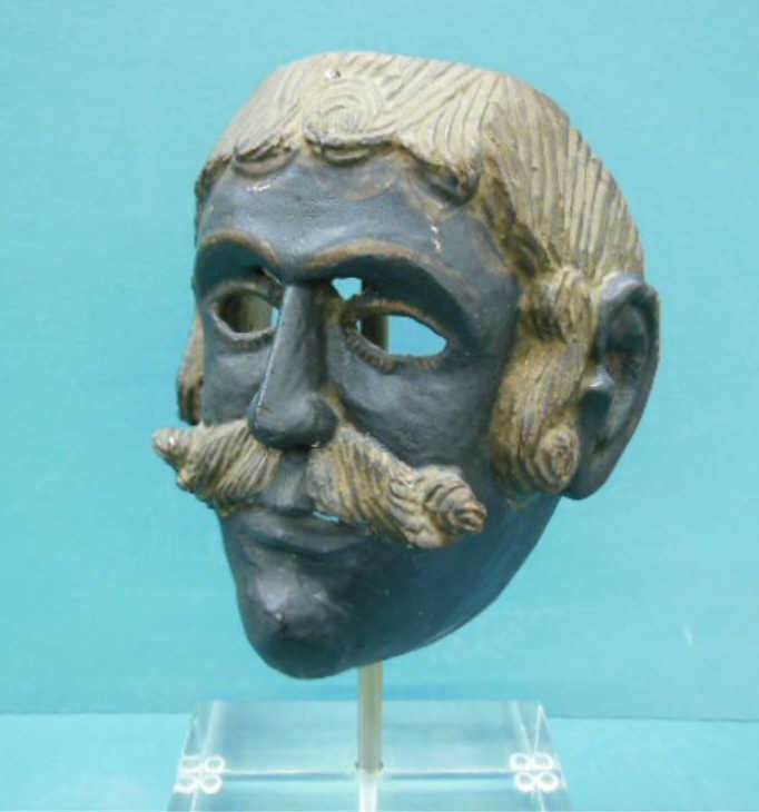 Vintage Tribal Mask w/Image of European Colonial: Vintage Tribal (possibly Middle Eastern) carved & polychrome mask displaying the image of a European colonial gentleman, late 19th / early 20th c., [ now mounted on a lucite base]. . 7 3/4" = h (mask)
