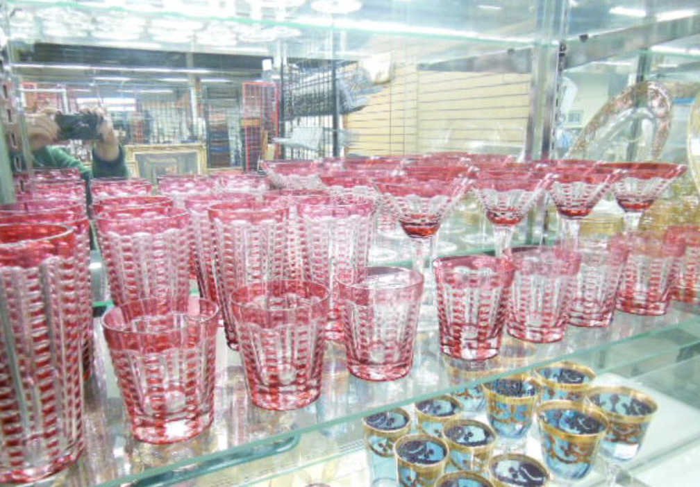 25 Pc William Yeoward Tumbler / Stemware Set: Twenty-five piece William Yeoward tumbler / stemware set; ruby cut to clear in a notched rib pattern, makers acid mark on bases, mid 20th C., includes: eight 3 3/4" juice; eight 6" tumblers, eight 6 3