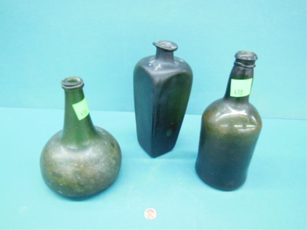 4 Vintage Bottles: Four vintage bottles: includes: mid 18th C. Dutch onion bottle in olive green paneled gin bottle & an olive green wine bottle; all from digs in Philadelphia, PA. CONDITION: Iridescent toning.