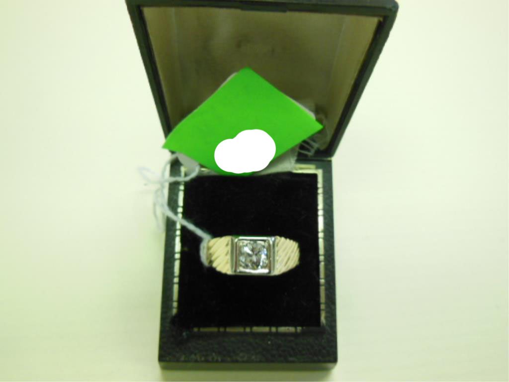 Gold & Diamond Gent's Ring: Gold & diamond gent's ring, 14k yellow gold reeded band with a square white gold bezel holding an approximate 1 ct round solitaire diamond SI-1, 4.6 DWT, size 12. [1]