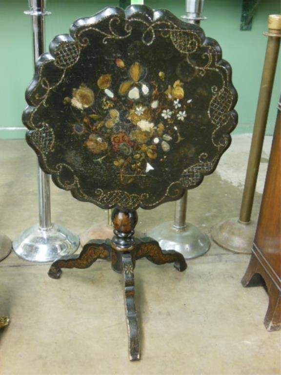 Victorian Lacquered Tilt Top Table: Victorian lacquered tilt top table, with floral & scroll paint, gilt & mother-of-pearl inlay, scalloped top, tripod shaped legs, mid 19th C., 25 1/2" d, 28 1/4' h. CONDITION: Scratches & wear to surfa