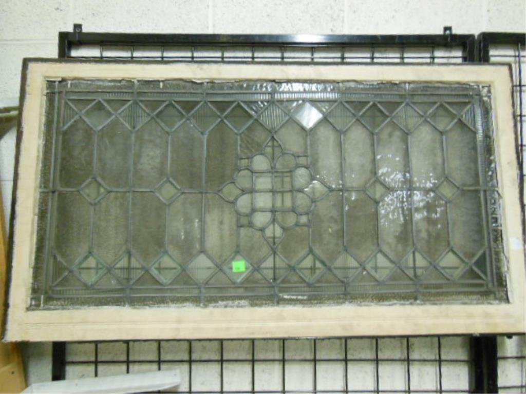 Framed Leaded Glass Window: Framed leaded glass window, clear & textured glass panes, diamond & geometric design, 29" x 51 1/2". CONDITION: Some wear to frame, bowed center section, one cracked textured glass panel.