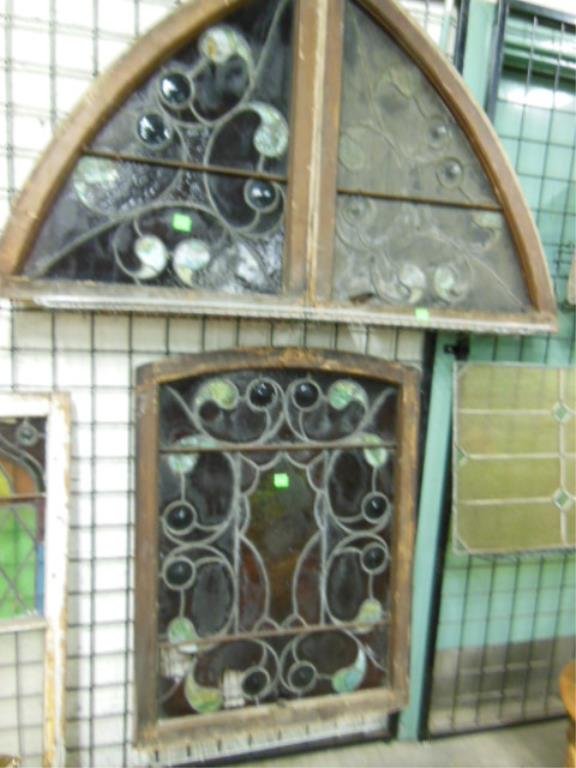 Set of 3 Arched Leaded Glass Windows: Set of 3 arched leaded glass windows, circle & paisley form, green, ruby & amber glass with jewels, late 19th C, 30" x 39 1/4" & 28 1/4" x 33 3/4". CONDITION:3 damaged ruby glass panels.