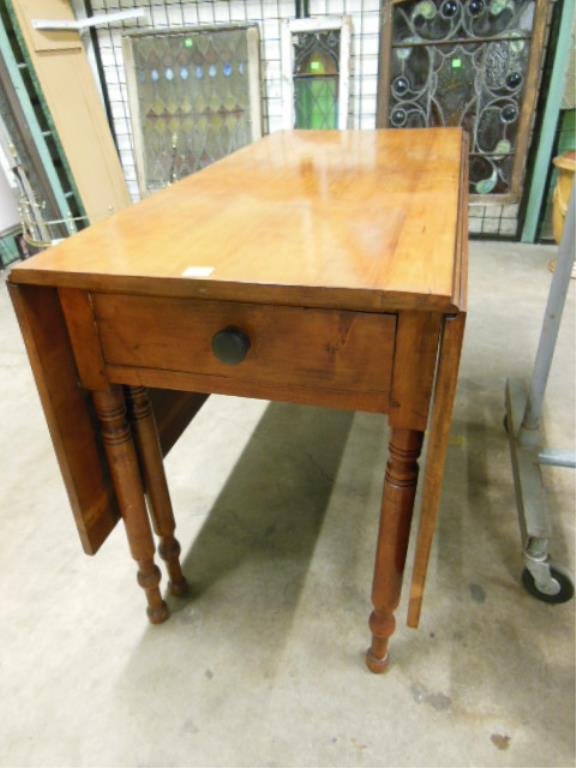 Cherry Drop Leaf Table: Sheraton, six Gate legs, double full length drop leaves, one drawer, cherry, 47 1/4" l x 22 1/4" w x 31" h,: 20" leaves. CONDITION: Some wear from age.