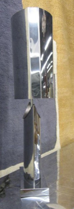 Curtis Jere 1976 Chrome Table Lamp: Curtis Jere 1976, chrome table lamp in elongated quarter moon form with matching ovoid shade, signed on rear platform. [28] CONDITION: Ding on shade & base rim bend on shade.